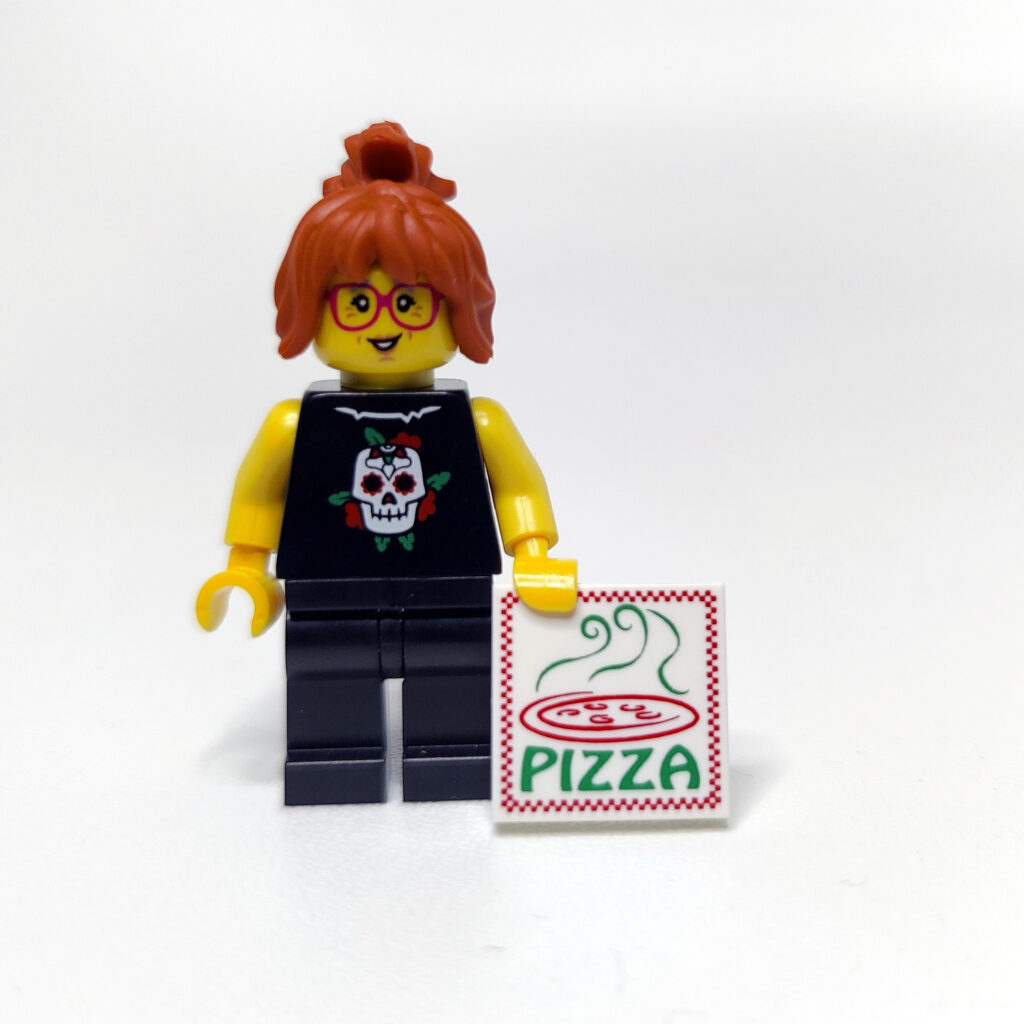 Lego figure holding pizza, changed pants.